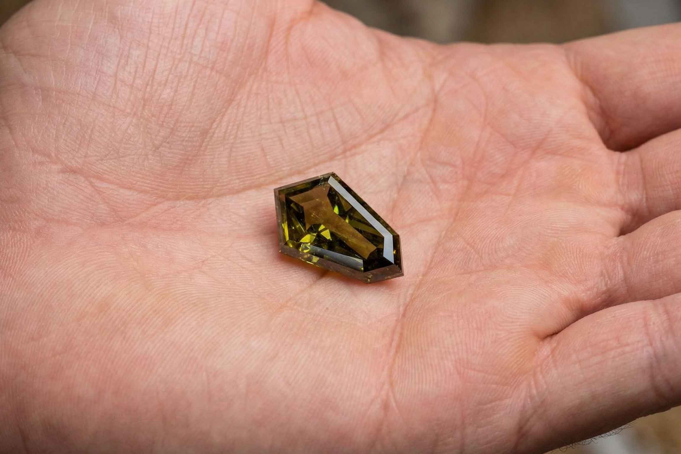 A diamond on a man's palm