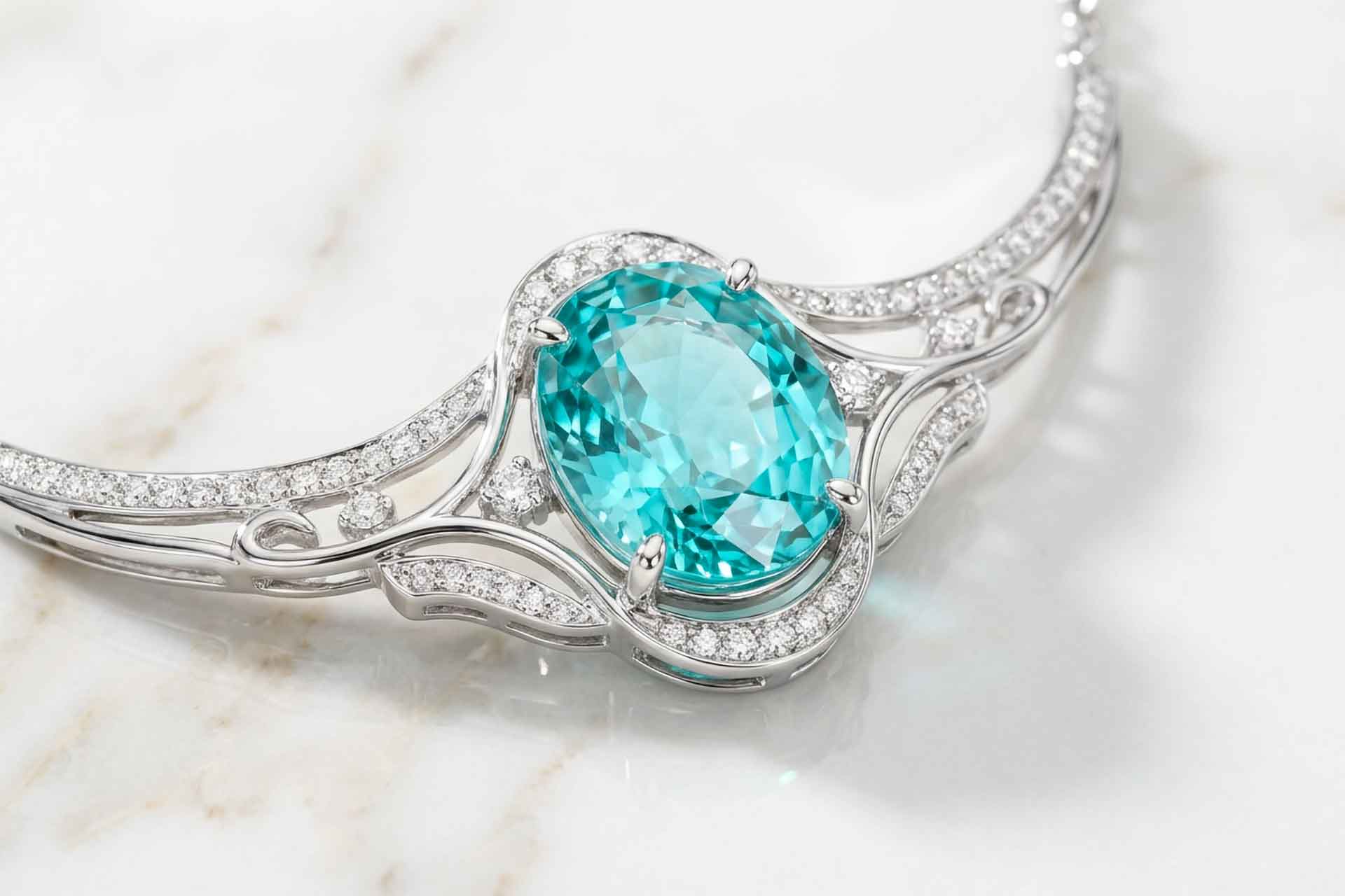 A necklace with paraiba on the marble table