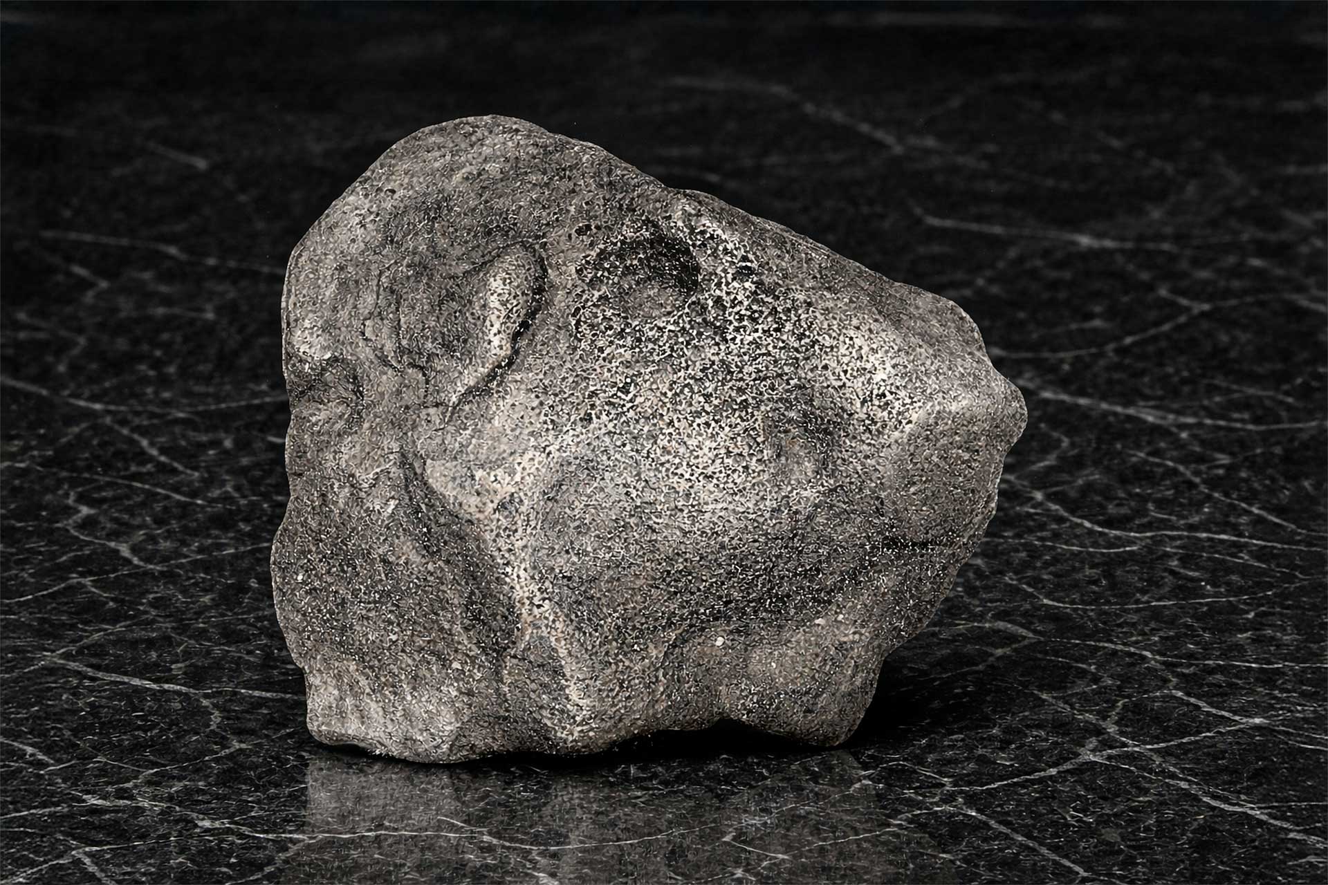 The Sergio Diamond on black marble surface