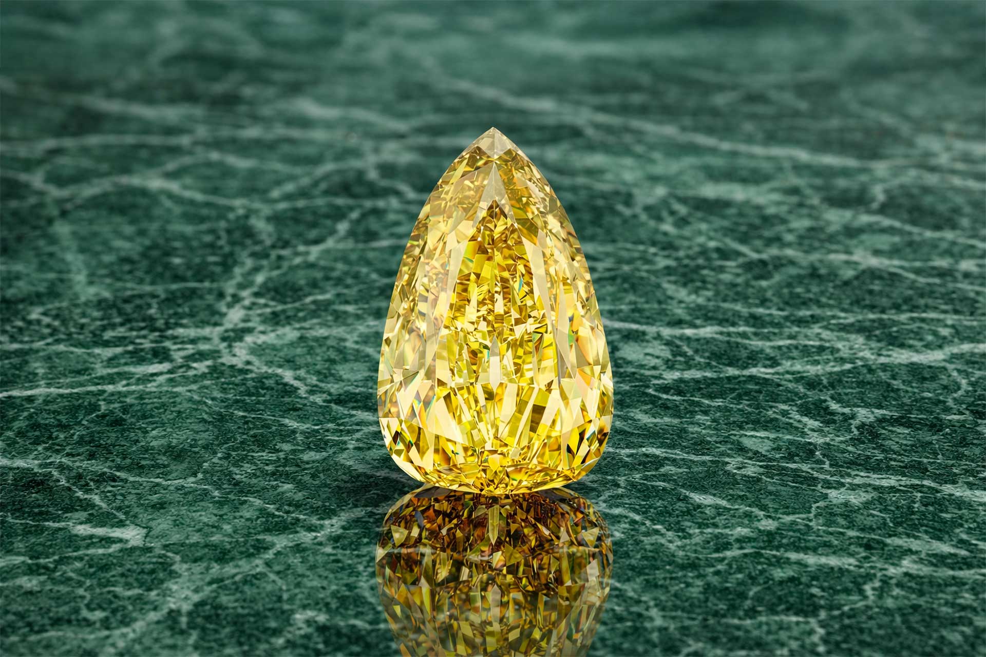 The Incomparable Diamond on green marble surface