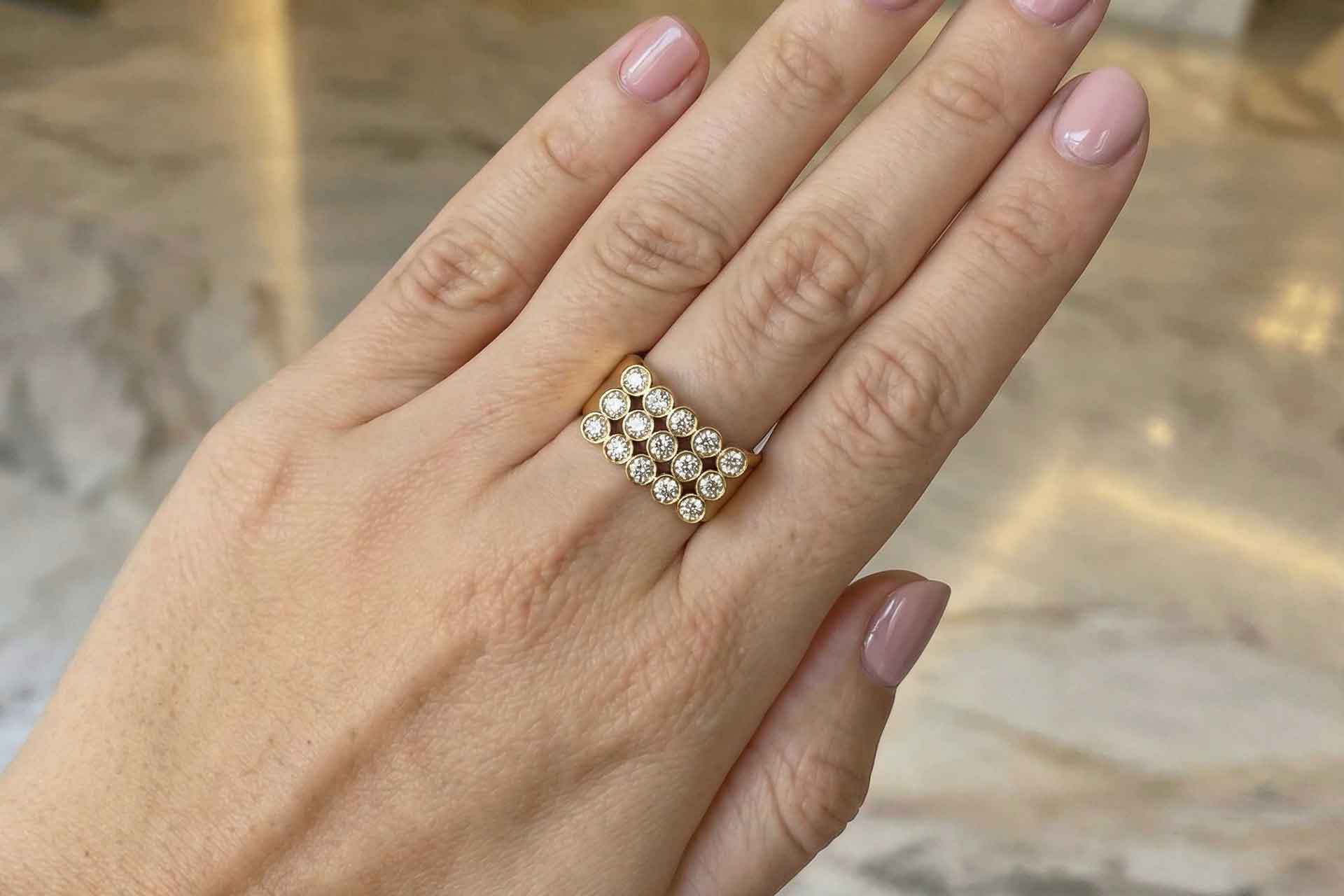 A ring with diamonds on a finger
