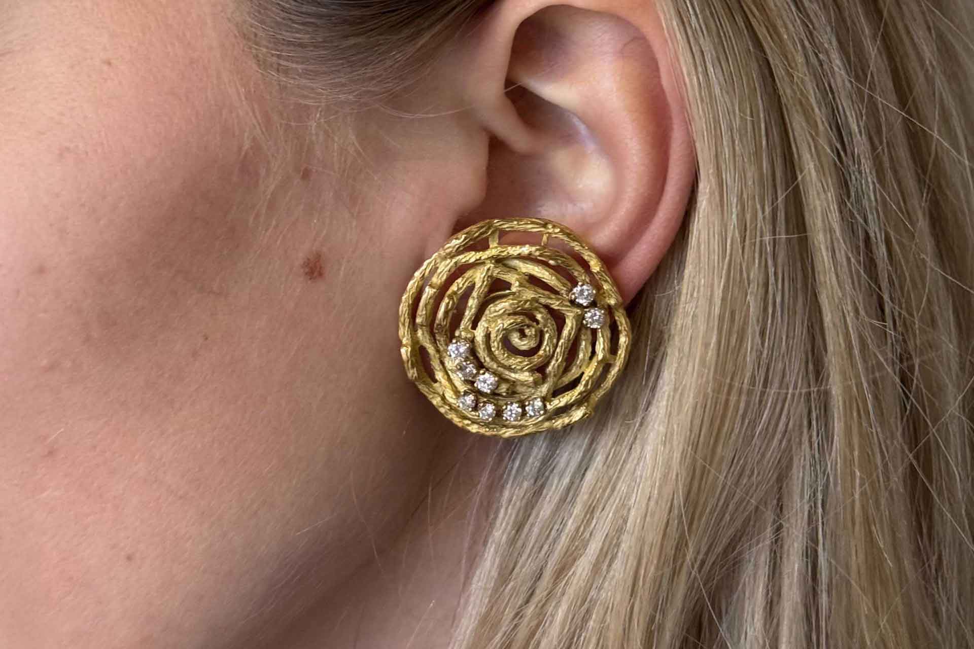 Chaumet earring in a ear