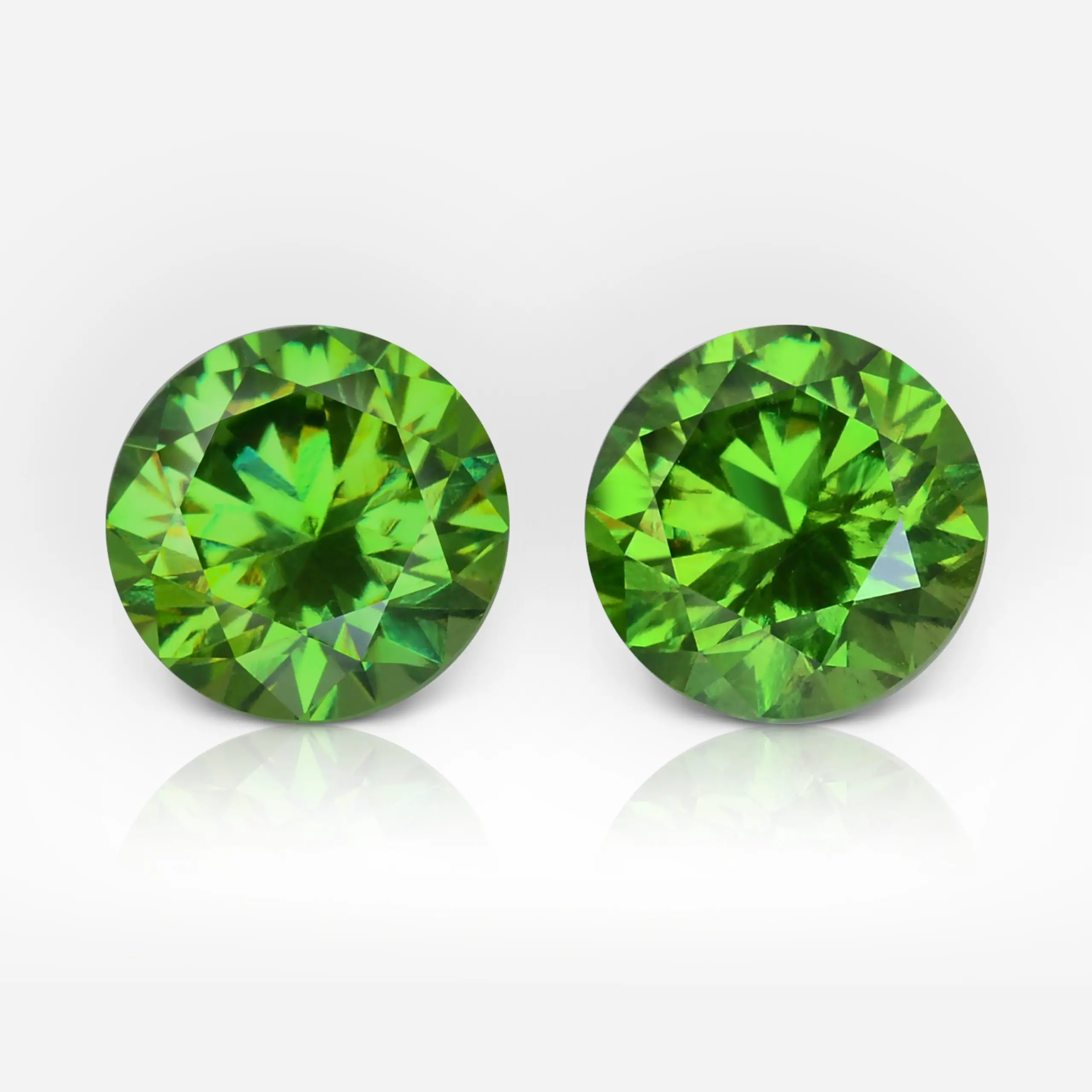 1.49 and 1.64 carat Pair of Round Shape Uralian Demantoid - picture 1