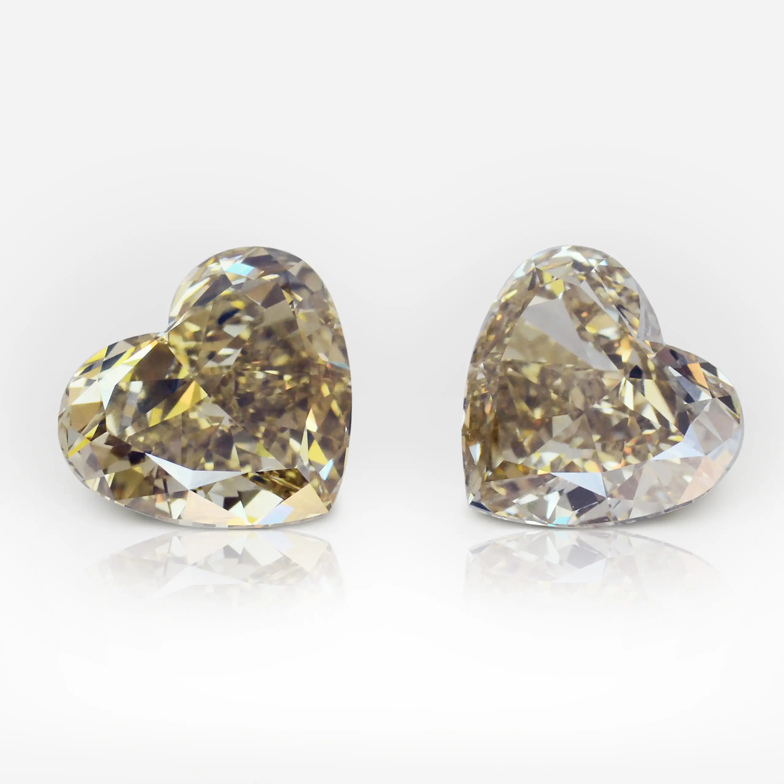 4.20 and 4.20 carat Pair of Fancy Deep Brown Yellow VVS1 Heart Shape Diamonds - picture 1