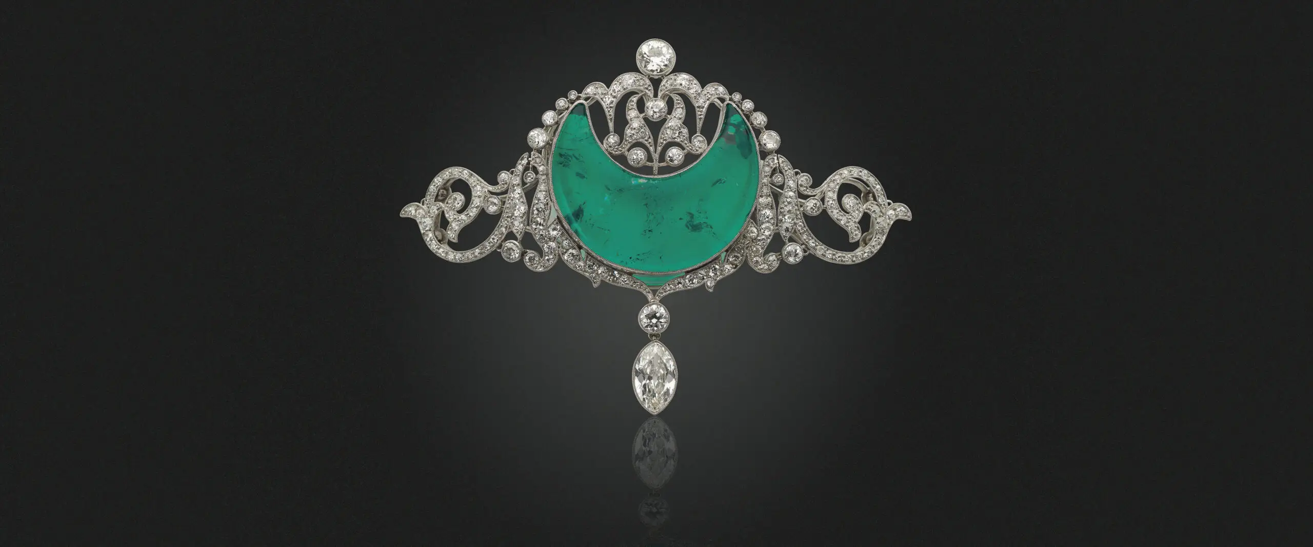 The belle époque emerald and diamond brooch