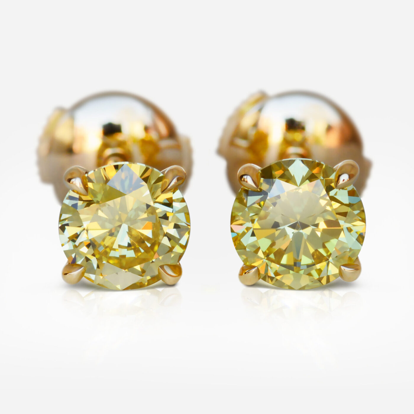 1.01 and 1.13 carat Pair of Fancy Intense Yellow VS1 / VS2 Round Shape Diamonds studs GIA - picture 1