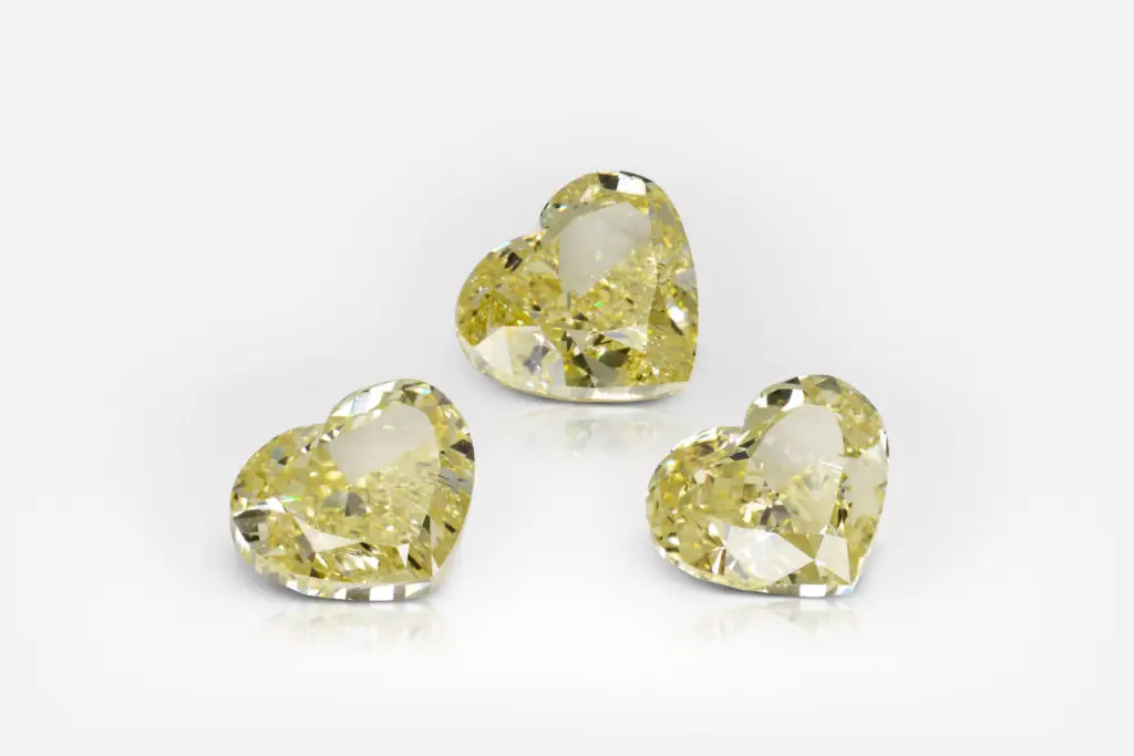 2 ct each Fancy Intense Yellow Heart Shape Diamond Studs GIA - picture 1