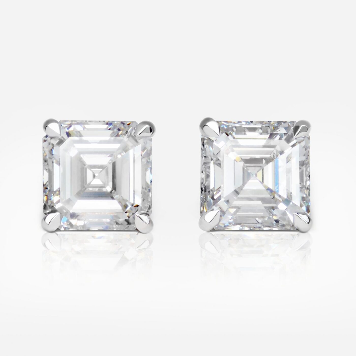 5.01 and 5.05 Carat Pair of G color Square Emerald Cut Shape Diamond Studs GIA - picture 1