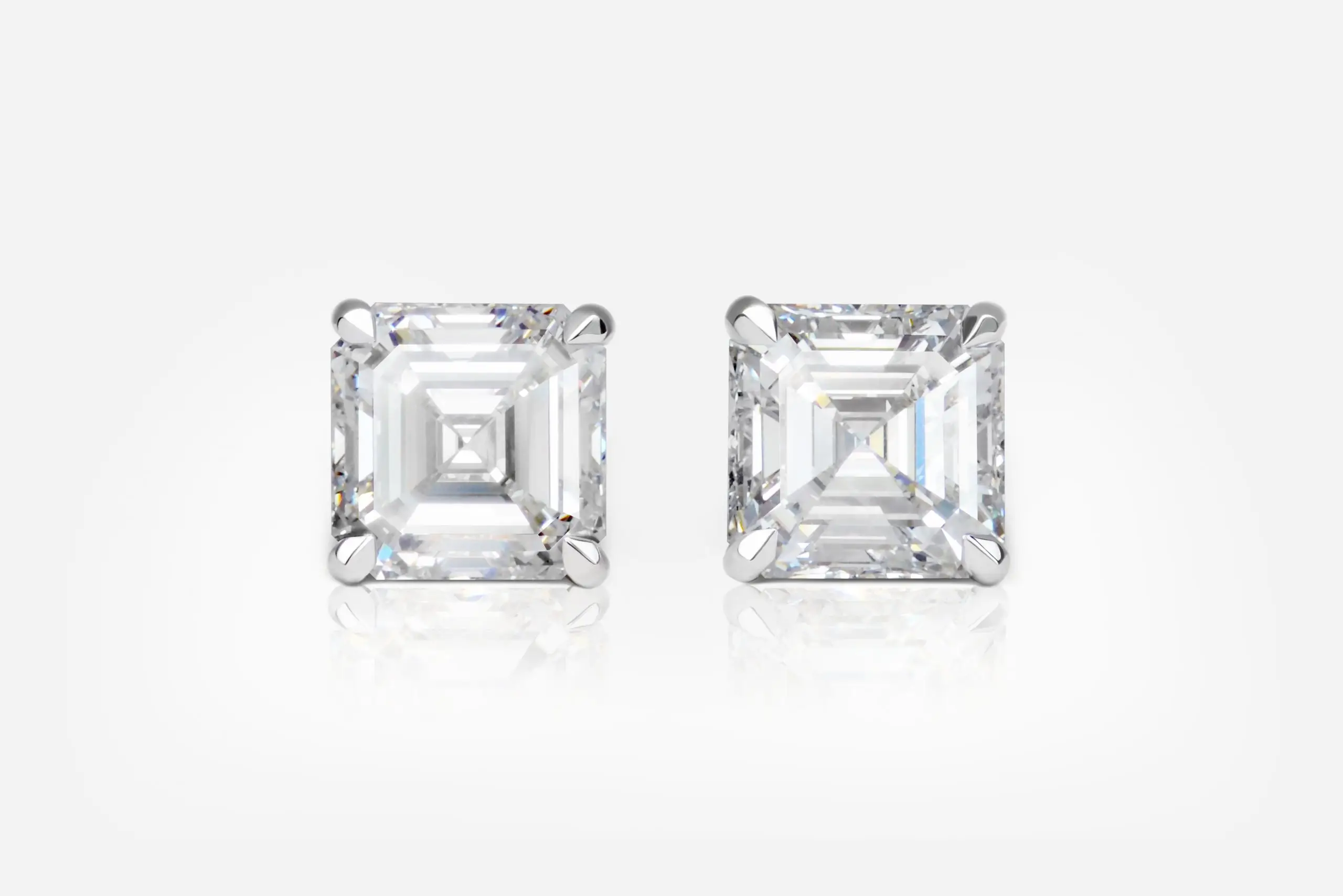 5.01 and 5.05 Carat Pair of G color Square Emerald Cut Shape Diamond Studs GIA - picture 1