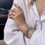 Art Deco Line Bracelet on Gray Background on Woman's Hand