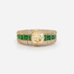 Bulgari Yellow Gold Diamond and Emerald Bangle on Gray Background