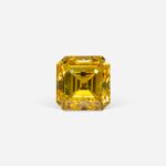 0.20 Ct Fancy Vivid Orangy Yellow Square Emerald Cut Natural Diamond on Gray Background