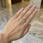 18K Yellow Gold Tubular Band Ring with Brilliant-Cut Diamonds on a woman's hand