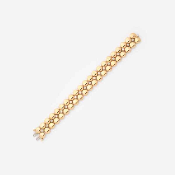 Cartier "Honeymoon" Diamond and Gold Bracelet on Gray Background