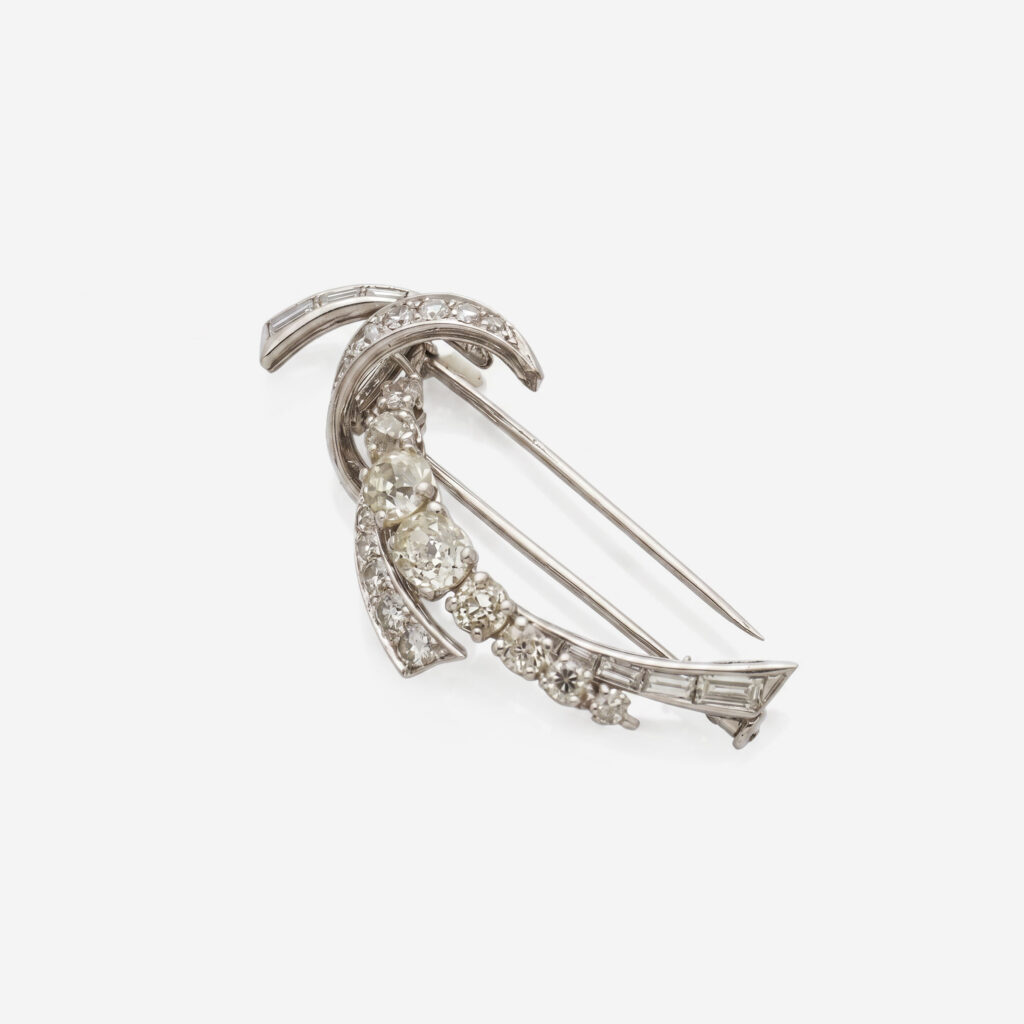 Mauboussin Platinum and White Gold “Volutes” Corsage Clip with Diamonds, French, circa 1950