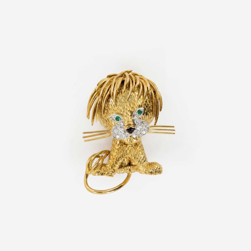 Van Cleef & Arpels Signed “Lion Ébouriffé” Yellow Gold Brooch-Clip with Emeralds and Diamonds