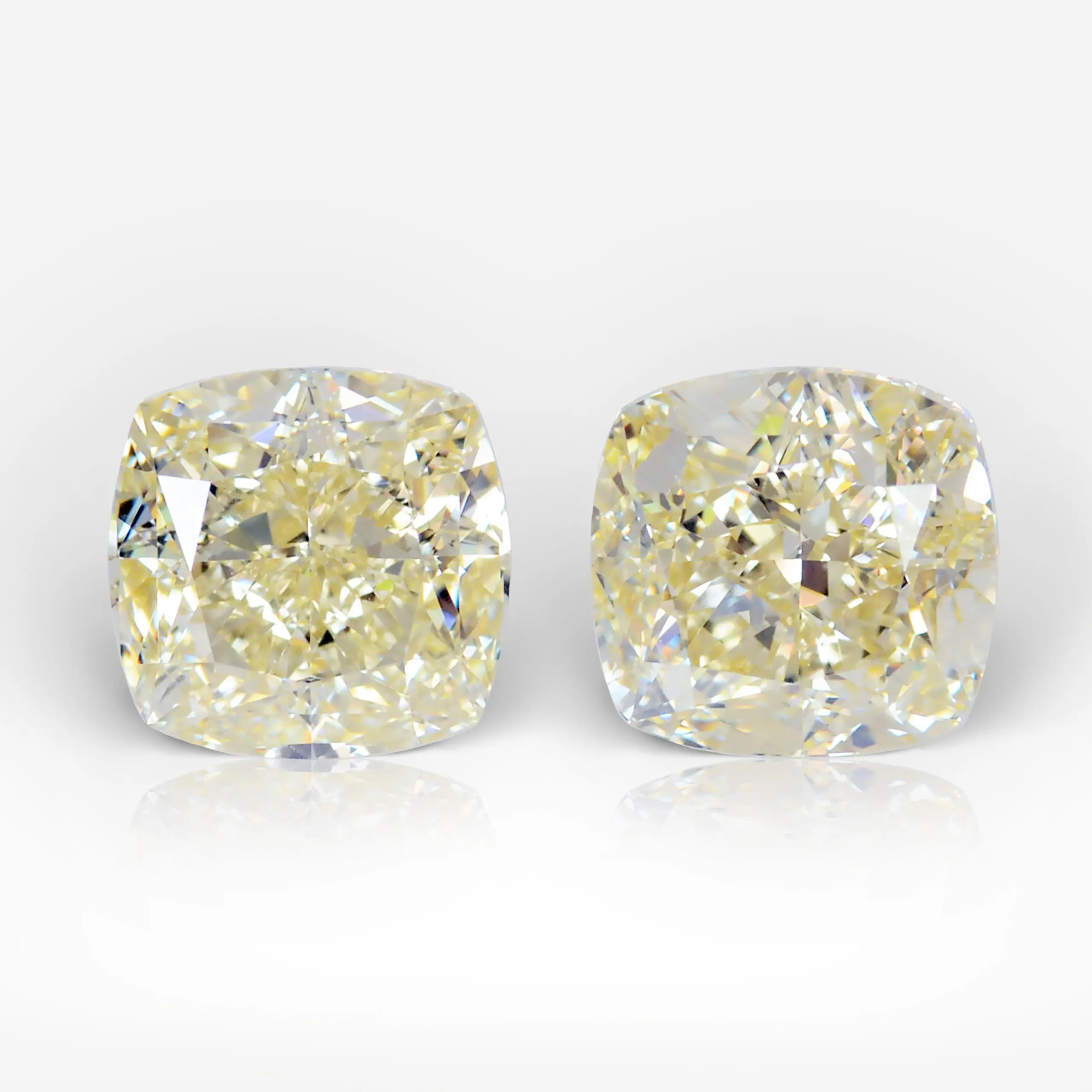 2.03 and 2.01 carat Pair of Yellow (W-X) VS1/VVS2 Cushion Shape Diamonds GIA - picture 1