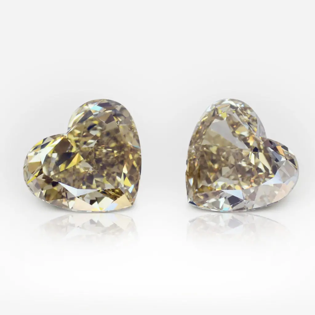4.20 and 4.20 carat Pair of Fancy Deep Brown Yellow VVS1 Heart Shape Diamonds