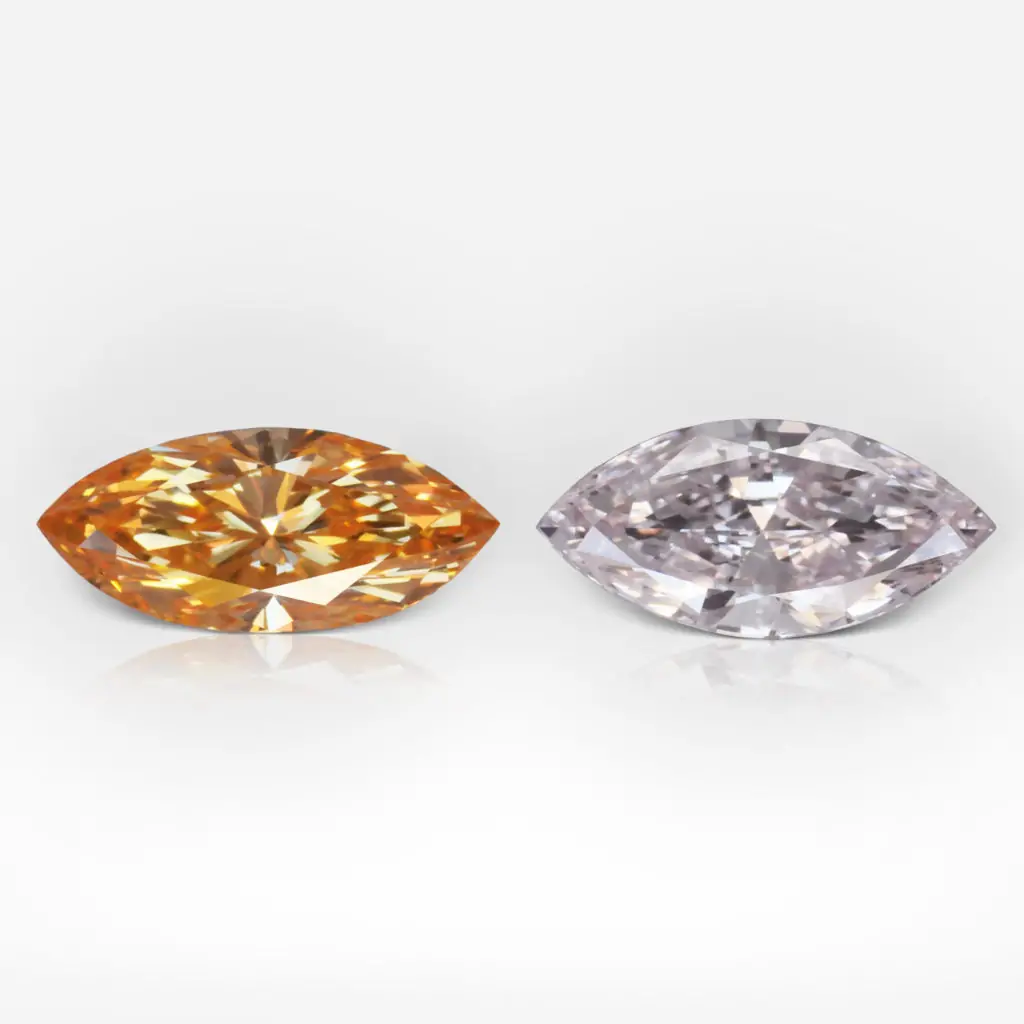 0.31 and 0.29 carat Pair of Fancy Intense Orange Yellow / Fancy Light Pink VS2 Marquis Shape Diamonds GIA