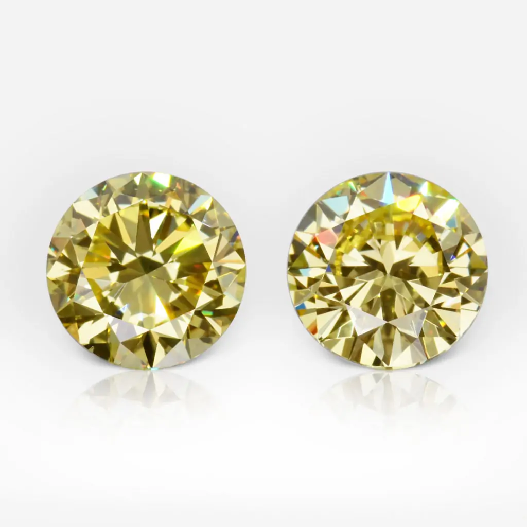1.01 and 1.13 carat Pair of Fancy Intense Yellow VS1 / VS2 Studs Round Shape Diamonds GIA - picture 1
