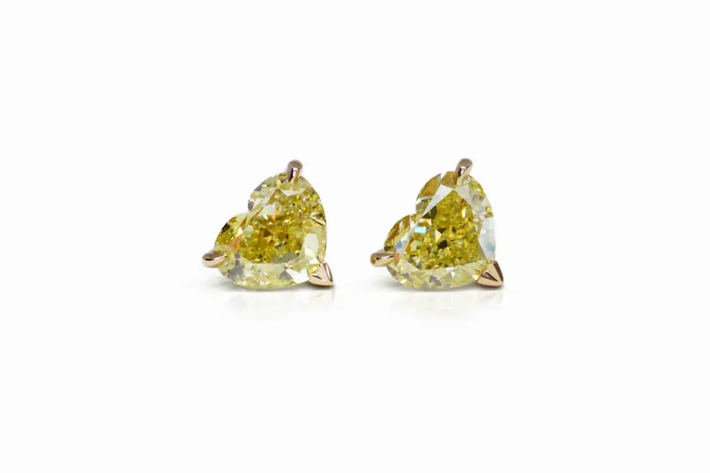 3.01 and 3.01 carat Pair of Studs Fancy Intense Yellow VS2/SI1 Heart Shape Diamonds GIA