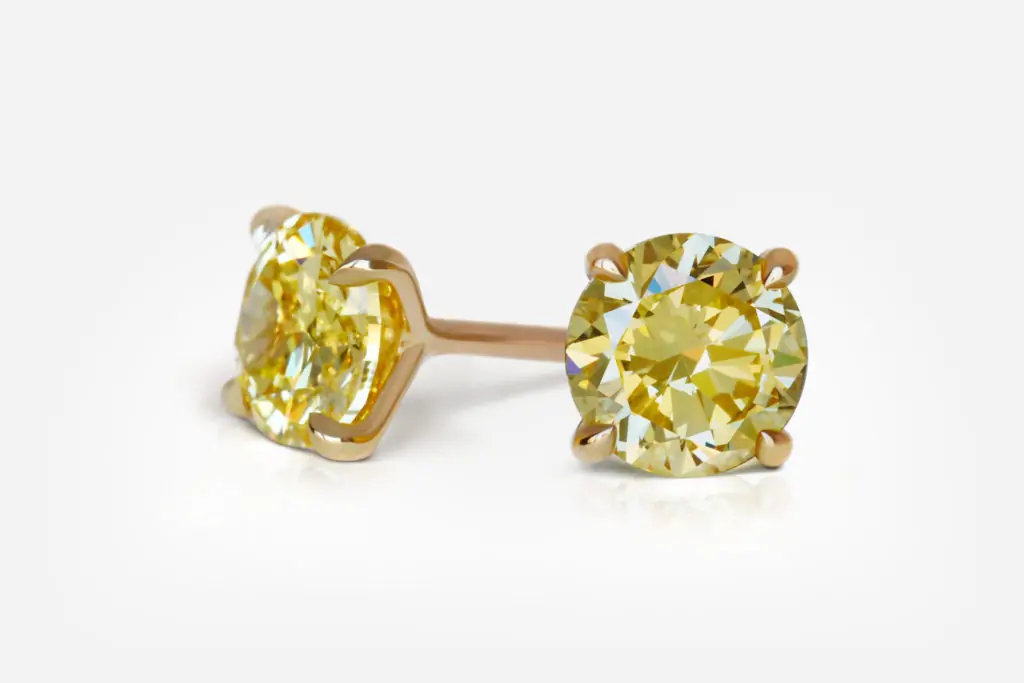 1.01 and 1.13 carat Pair of Fancy Intense Yellow VS1 / VS2 Round Shape Diamonds studs GIA - picture 1