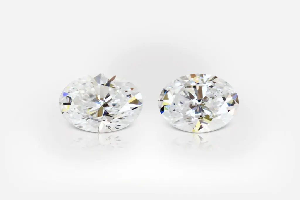 0.31 + 0.29 carat F VS1 Pair Oval Shape Diamonds - picture 1